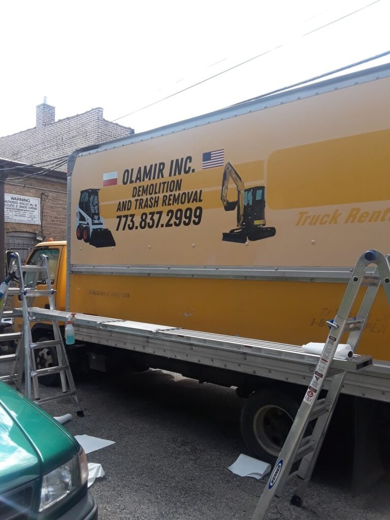 Decals ad on yellow box truck Bensenville, Illinois